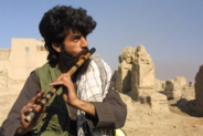 Afghan playing flute